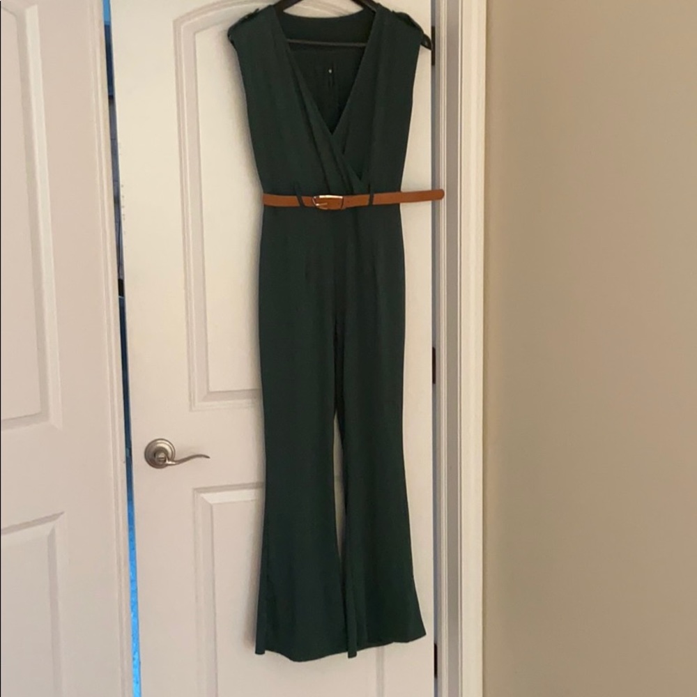 Green jumpsuit with tan belt.